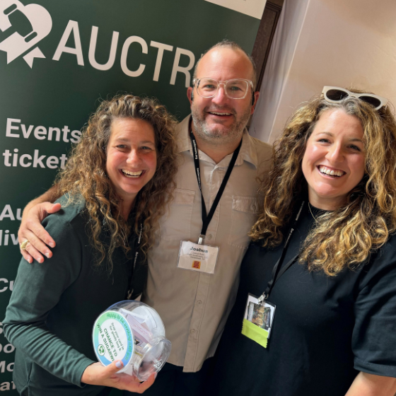 Auctria staff with community members